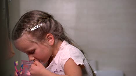 five-year-old-girl-brushes-teeth