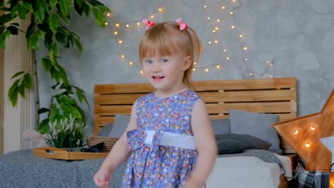 Portrait-of-funny-little-girl-at-home