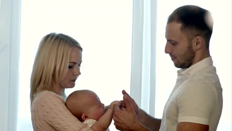 Parents-with-baby-on-hands