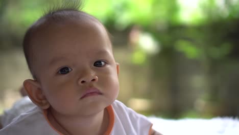 Happy-portrait-baby-boy-playing-alone