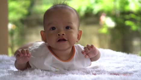 Happy-portrait-baby-boy-playing-alone