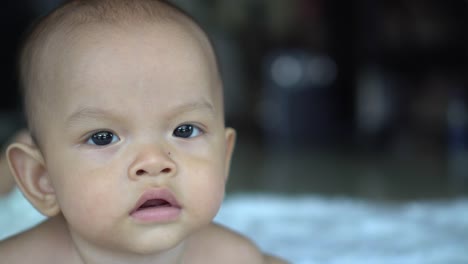 Happy-portrait-baby-boy-playing-alone