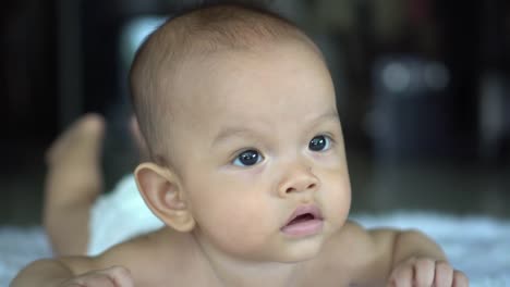 Happy-portrait-baby-boy-playing-alone