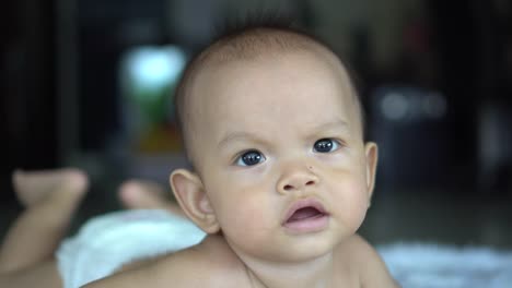 Happy-portrait-baby-boy-playing-alone