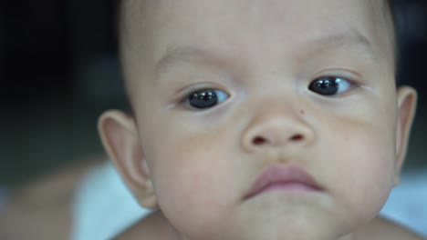 Happy-portrait-baby-boy-playing-alone