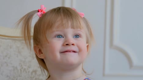 Portrait-of-funny-little-girl-at-home