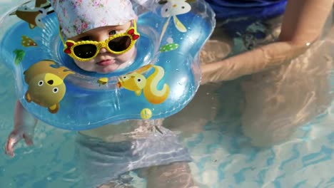 Baby-swimming-with-neck-swim-ring