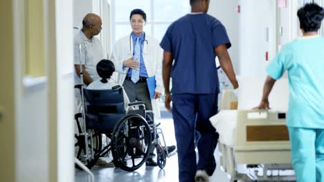 Ethnic-disabled-female-in-wheelchair-in-medical-centre