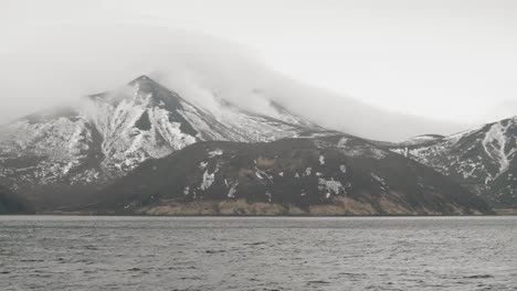 Natural-landscape-mountain-with-snowy-peaks-and-sea-water.-View-from-cruise-ship