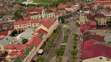 Aerial-view-Peace-Square-of-Mukachevo.-Nearby-is-the-Gothic-chapel-of-St.-Joseph,-city-hall-і-Cathedral-Church-of-St.-Martine.-Eastern-Carpathian-mountains.-Ukraine