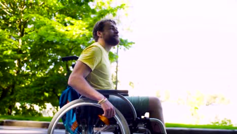 Young-disable-man-in-a-wheelchair-in-the-park