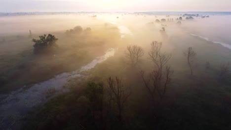 Aerial-footage-video-of-foggy-morning.-Flying-over-the-Desna-river.-Sunrise-time.-Kyiv-region,-Ukraine.