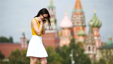 Happy-young-urban-woman-in-european-city.