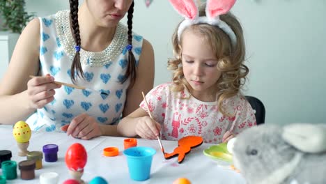 Cute-Girl-Painting-with-Orange-Color-Wooden-Bunny