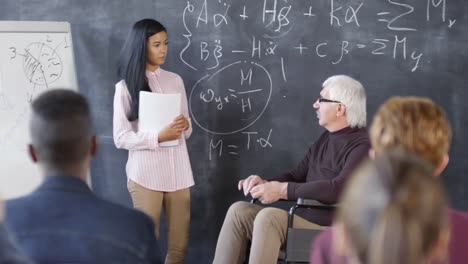 Disabled-Teacher-Discussing-Equations-with-Student