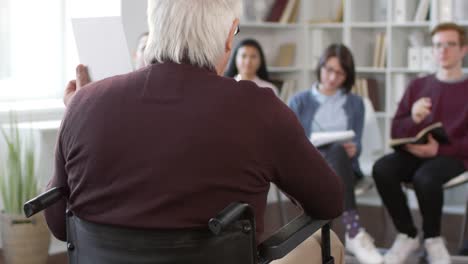 Disabled-Professor-Showing-Picture-to-Students