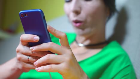 phone-closeup-in-the-hands-of-a-girl-who-writes-an-emotional-message