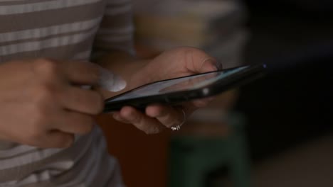 Close-up-woman-hands-using-mobile-smart-phone-for-communication.