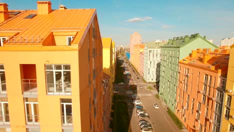 Flying-over-cozy-comfortable-colorful-buildings-in-a-European-city-4K-UHD-aerial