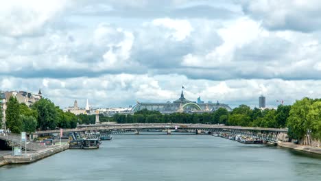 View-of-the-Grand-Palais-exhibition-hall-and-boats-on-the-Seine-River-as-seen-from-Royal-bridge-timelapse