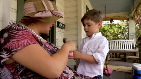 Mom-wearing-a-spring-easter-outfit-talking-with-her-cute-4---5-year-old-son