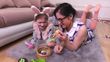 Mother-and-daughter-with-Easter-eggs-in-basket-no-floor