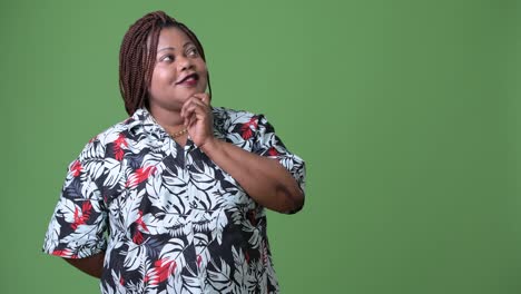 Overweight-beautiful-African-woman-against-green-background