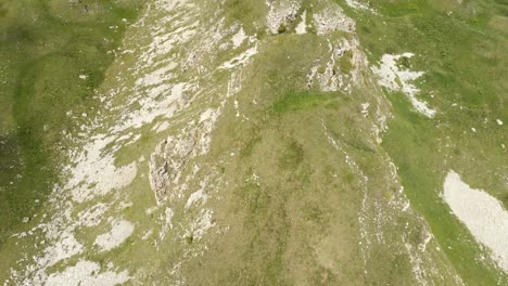 Flying-over-a-large-rock-formation-among-the-green-fields.-Russia.-North-Caucasus-Video-from-the-drone