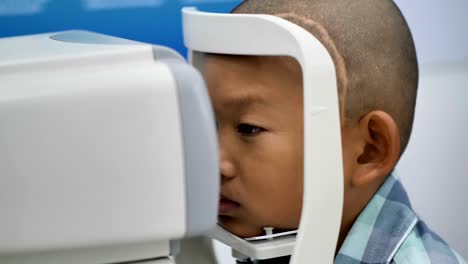 eyesight-check.-Asian-boys-who-have-vision-disabilities.-Left-eye-is-not-visible-from-brain-surgery.-Medical-treatment-and-Rehabilitation.-video-4k