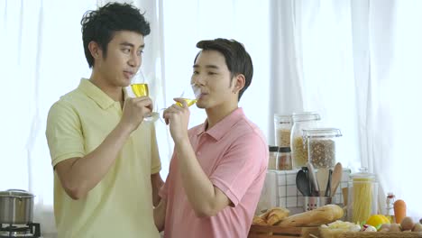 Happy-young-Asian-gay-couple-having-mini-party-together-at-home.-Lifestyle-couple-at-home-concept.