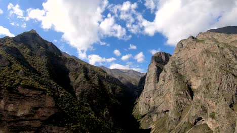 Timelapse-gorge-cliffs-with-moving-sky-shadows-and-clouds.