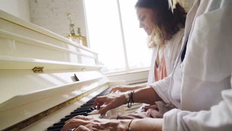 Girlfriends-playing-on-piano