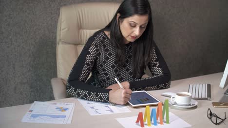 Indian-Businesswoman-Working-with-Charts