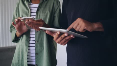 Man-and-woman's-hand-using-digital-tablet-and-smart-phone