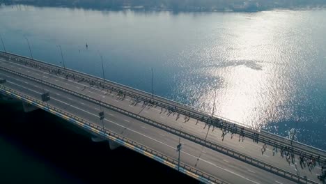 Marathon-running-on-the-bridge.-Dolly-shot