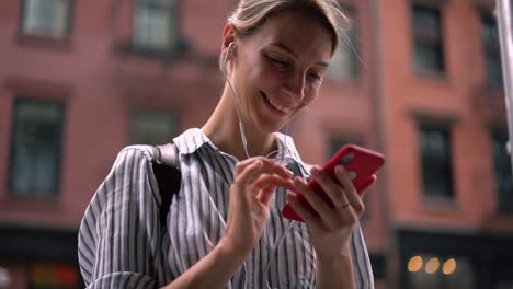 Slow-motion-effect-of-Caucasian-female-blogger-listening-audio-record-during-online-chatting-with-followers-from-social-networks