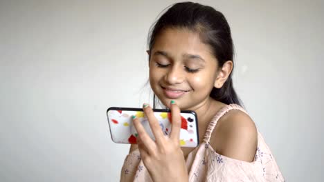 Indian-little-girl-is-Watching-cartoon-on-smartphone