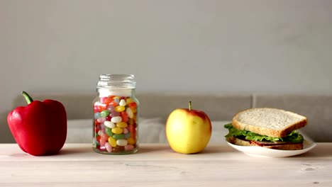 cute-little-boy-takes-jar-of-colorful-candy