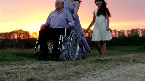 Elderly-Man-In-a-Wheelchair-With-Family