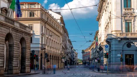 Traffic-on-Alessandro-Manzoni-street-near-main-concert-hall-of-Teatro-alla-Scala,-an-opera-house-timelapse-in-Milan,-Italy