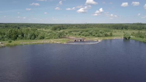 Aerial-shot-of-the-dam.-The-wide-river-becomes-narrow.