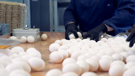 Worker-packing-fresh-eggs-in-the-egg-sorting-factory.