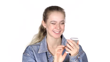 Casual-Young-Woman-Excited-for-Success-while-Using-Smartphone