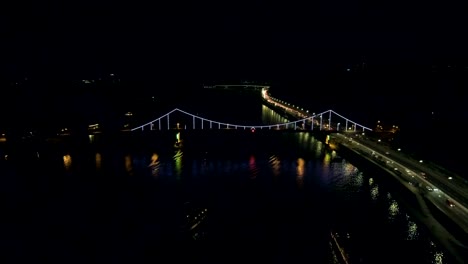 Aerial-view-from-Drone:-Top-view-of-the-night-promenade-with-bridges-and-cars.