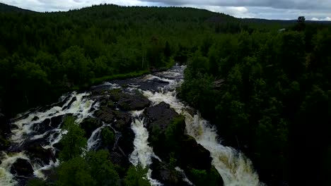 Aerial-sliding-by-the-forest-river-at-Karelia,-Russia