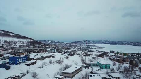 Aerial-view-of-Kamchatka-biggest-city-of-Petropavlosk,-volcanos-and-city