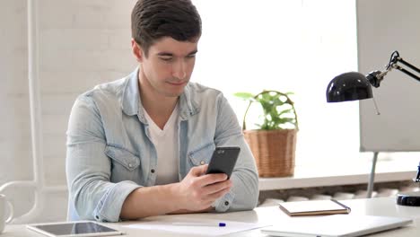 Young-Man-Using-Smartphone