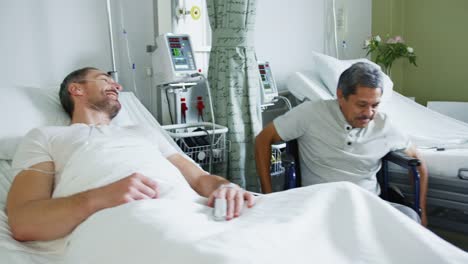 Two-male-patients-talking-in-a-hospital-ward-4k