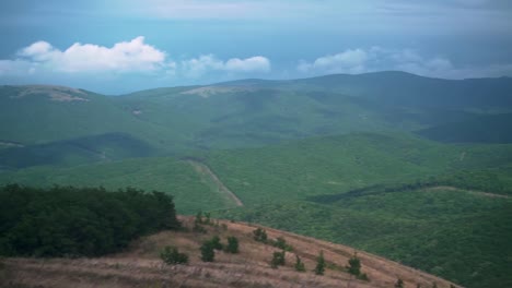 Footage-of-the-city-with-a-bay,-port,-buildings,-mountains.-Ariel-view-of-Novorossiysk.-Russia.