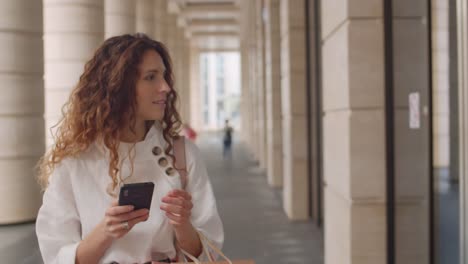 Woman-Walking-and-Using-Smartphone